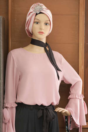 Female mannequins wearing modern batik muslim dresses and hijabs exhibited in batik workshopの写真素材