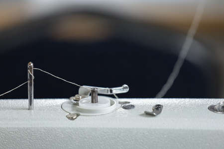 close-up sewing machine, automatic sewing machine, tinted image, selective focusingの写真素材