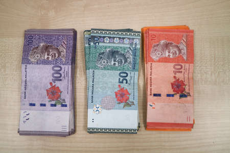 Malaysia currency of Malaysian ringgit banknotes .Paper money of ten ringgit, twenty ringgit, fifty ringgit and one hundred notes on closeup. Financial concept. selective focus and soft focusの写真素材