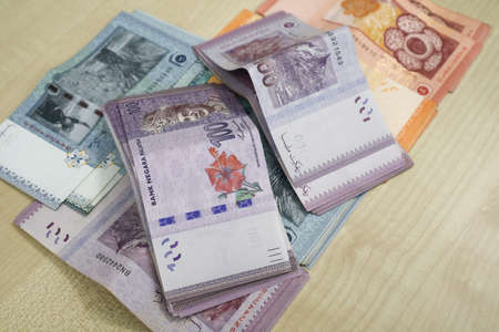 Malaysia currency of Malaysian ringgit banknotes .Paper money of ten ringgit, twenty ringgit, fifty ringgit and one hundred notes on closeup. Financial concept. selective focus and soft focusの写真素材