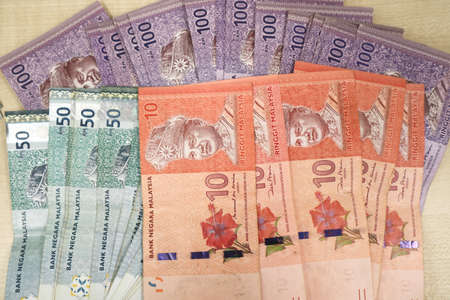 Malaysia currency of Malaysian ringgit banknotes .Paper money of ten ringgit, twenty ringgit, fifty ringgit and one hundred notes on closeup. Financial concept. selective focus and soft focusの写真素材