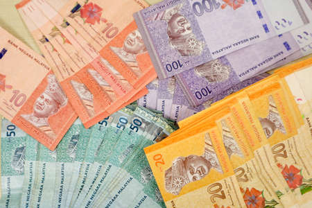 Malaysia currency of Malaysian ringgit banknotes .Paper money of ten ringgit, twenty ringgit, fifty ringgit and one hundred notes on closeup. Financial concept. selective focus and soft focusの写真素材