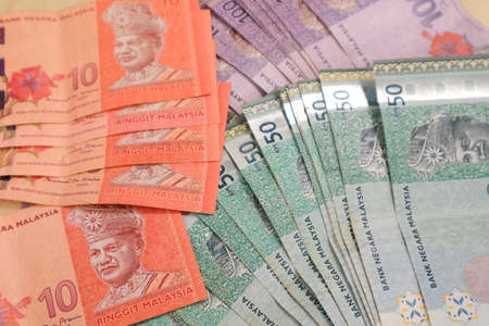 Malaysia currency of Malaysian ringgit banknotes .Paper money of ten ringgit, twenty ringgit, fifty ringgit and one hundred notes on closeup. Financial concept. selective focus and soft focusの写真素材