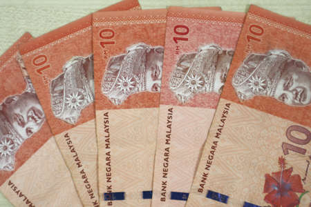 Malaysia currency of Malaysian ringgit banknotes .Paper money of ten ringgit, twenty ringgit, fifty ringgit and one hundred notes on closeup. Financial concept. selective focus and soft focusの写真素材