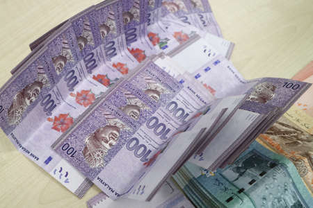 Malaysia currency of Malaysian ringgit banknotes .Paper money of ten ringgit, twenty ringgit, fifty ringgit and one hundred notes on closeup. Financial concept. selective focus and soft focusの写真素材