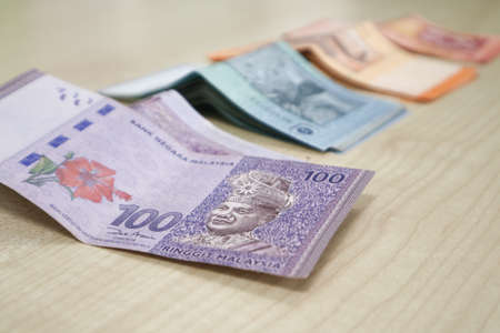 Malaysia currency of Malaysian ringgit banknotes .Paper money of ten ringgit, twenty ringgit, fifty ringgit and one hundred notes on closeup. Financial concept. selective focus and soft focusの写真素材