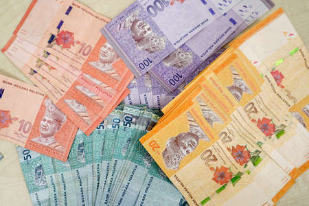 Malaysia currency of Malaysian ringgit banknotes .Paper money of ten ringgit, twenty ringgit, fifty ringgit and one hundred notes on closeup. Financial concept. selective focus and soft focusの写真素材