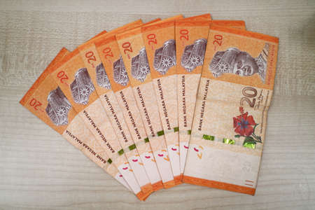 Malaysia currency of Malaysian ringgit banknotes .Paper money of ten ringgit, twenty ringgit, fifty ringgit and one hundred notes on closeup. Financial concept. selective focus and soft focusの写真素材