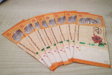 Malaysia currency of Malaysian ringgit banknotes .Paper money of ten ringgit, twenty ringgit, fifty ringgit and one hundred notes on closeup. Financial concept. selective focus and soft focusの写真素材