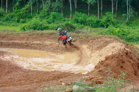 Alor Setar kedah Malaysia, 8 November 2015 -Unidentified motocross riders perform on the competes at Malaysia motocross championship 2015 first round onのeditorial素材