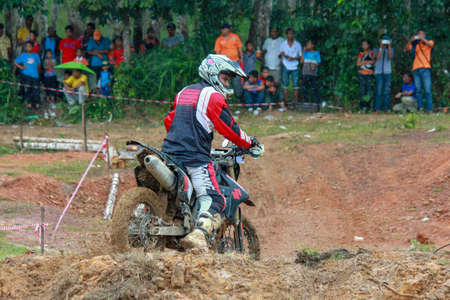 Alor Setar kedah Malaysia, 8 November 2015 -Unidentified motocross riders perform on the competes at Malaysia motocross championship 2015 first round onのeditorial素材