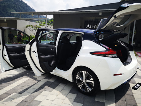 Bukit Tinggi Pahang,Malaysia - 24 Julai, 2019: Metallic White Nissan Leaf at Aurel Sanctuary Galery Bentong Pahang, compact five-door hatchback electric car manufactured by Nissan.のeditorial素材