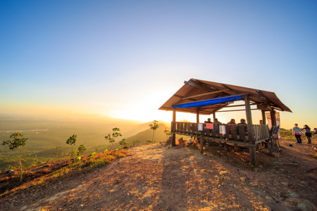kedah, Malaysia - December 13, 2019: Hiker enjoying nature on top of mountain with sunrise, many residents around Bukit Laka, Changlun climb the hill to see the beautiful scenery in the morningのeditorial素材