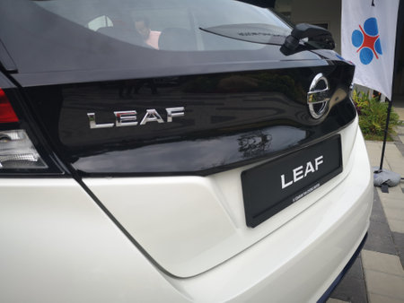 Bukit Tinggi Pahang,Malaysia - 24 Julai, 2019: Metallic White Nissan Leaf at Aurel Sanctuary Galery Bentong Pahang, compact five-door hatchback electric car manufactured by Nissan.のeditorial素材