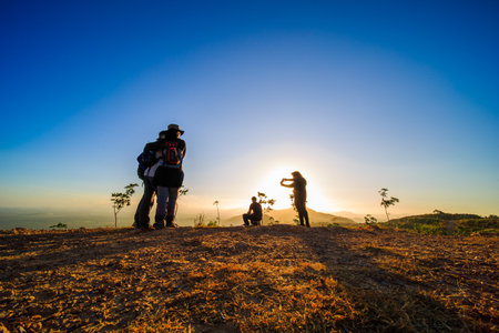 kedah, Malaysia - December 13, 2019: Hiker enjoying nature on top of mountain with sunrise, many residents around Bukit Laka, Changlun climb the hill to see the beautiful scenery in the morningのeditorial素材
