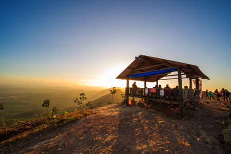 kedah, Malaysia - December 13, 2019: Hiker enjoying nature on top of mountain with sunrise, many residents around Bukit Laka, Changlun climb the hill to see the beautiful scenery in the morningのeditorial素材