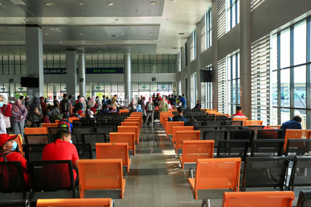 LANGKAWI,KEDAH-DECEMBER 23 2020: Crowd of unrecognizable local tourist wearing surgical mask for prevent coronavirus Outbreak  at Langkawi Jetty Point Kuahのeditorial素材