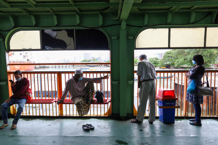 Pulau Pinang , Malaysia - Dec 19 2020: Crowd of unrecognizable local tourist wearing surgical mask for prevent coronavirus Outbreak at Butterworth ferry terminal to Penang islandのeditorial素材