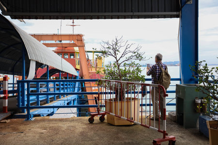 Pulau Pinang , Malaysia - Dec 19 2020: Crowd of unrecognizable local tourist wearing surgical mask for prevent coronavirus Outbreak at Butterworth ferry terminal to Penang islandのeditorial素材