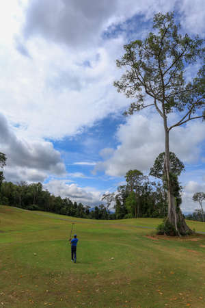 Sintok, Kedah - Sept 28, 2020: Golfer preparing to hit the ball for the second shots on the fairway.のeditorial素材