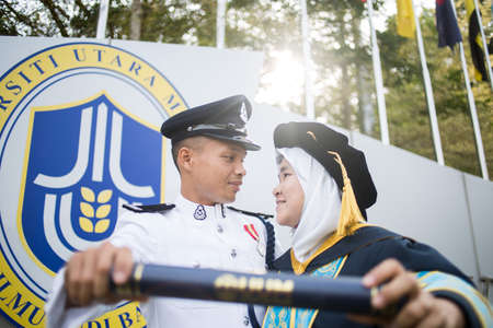 Sintok, Kedah, Malaysia - Circa October, 2019 - Asian university student celebrating graduation outdoorのeditorial素材