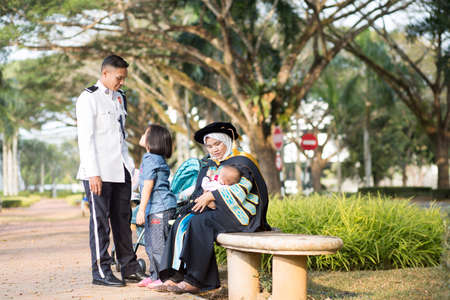 Sintok, Kedah, Malaysia - Circa October, 2019 - Asian university student celebrating graduation outdoorのeditorial素材