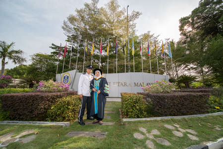 Sintok, Kedah, Malaysia - Circa October, 2019 - Asian university student celebrating graduation outdoorのeditorial素材