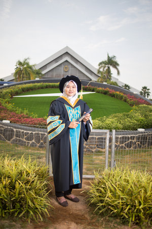 Sintok, Kedah, Malaysia - Circa October, 2019 - Asian university student celebrating graduation outdoorのeditorial素材