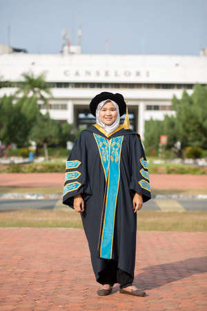 Sintok, Kedah, Malaysia - Circa October, 2019 - Asian university student celebrating graduation outdoorのeditorial素材