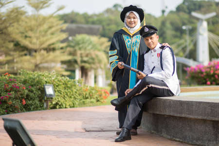 Sintok, Kedah, Malaysia - Circa October, 2019 - Asian university student celebrating graduation outdoorのeditorial素材