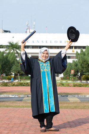 Sintok, Kedah, Malaysia - Circa October, 2019 - Asian university student celebrating graduation outdoorのeditorial素材