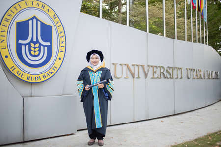 Sintok, Kedah, Malaysia - Circa October, 2019 - Asian university student celebrating graduation outdoorのeditorial素材