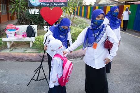 Alor Setar Kedah,Malaysia-March 1,2021:The first day of the school session for preschool students in Alor Setar during the Covid-19 pandemic season is hitting the world.のeditorial素材