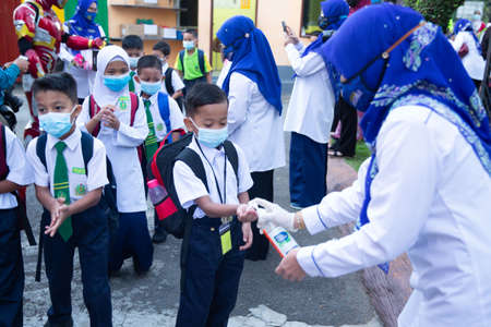 Alor Setar Kedah,Malaysia-March 1,2021:The first day of the school session for preschool students in Alor Setar during the Covid-19 pandemic season is hitting the world.のeditorial素材