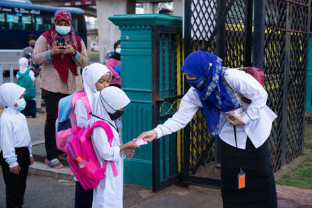 Alor Setar Kedah,Malaysia-March 1,2021:The first day of the school session for preschool students in Alor Setar during the Covid-19 pandemic season is hitting the world.のeditorial素材