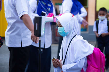 Alor Setar Kedah,Malaysia-March 1,2021:The first day of the school session for preschool students in Alor Setar during the Covid-19 pandemic season is hitting the world.のeditorial素材