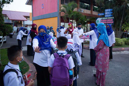 Alor Setar Kedah,Malaysia-March 1,2021:The first day of the school session for preschool students in Alor Setar during the Covid-19 pandemic season is hitting the world.のeditorial素材