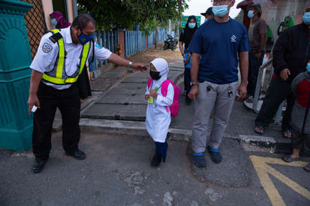 Alor Setar Kedah,Malaysia-March 1,2021:The first day of the school session for preschool students in Alor Setar during the Covid-19 pandemic season is hitting the world.のeditorial素材