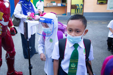 Alor Setar Kedah,Malaysia-March 1,2021:The first day of the school session for preschool students in Alor Setar during the Covid-19 pandemic season is hitting the world.のeditorial素材