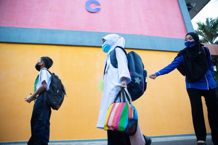 Alor Setar Kedah,Malaysia-March 1,2021:The first day of the school session for preschool students in Alor Setar during the Covid-19 pandemic season is hitting the world.のeditorial素材