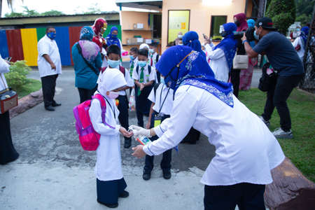 Alor Setar Kedah,Malaysia-March 1,2021:The first day of the school session for preschool students in Alor Setar during the Covid-19 pandemic season is hitting the world.のeditorial素材