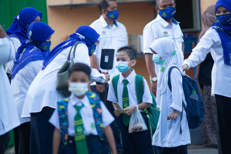 Alor Setar Kedah,Malaysia-March 1,2021:The first day of the school session for preschool students in Alor Setar during the Covid-19 pandemic season is hitting the world.のeditorial素材