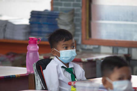 Alor Setar Kedah,Malaysia-March 1,2021:The first day of the school session for preschool students in Alor Setar during the Covid-19 pandemic season is hitting the world.のeditorial素材