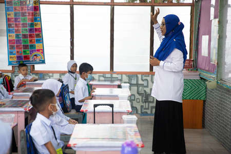 Alor Setar Kedah,Malaysia-March 1,2021:The first day of the school session for preschool students in Alor Setar during the Covid-19 pandemic season is hitting the world.のeditorial素材