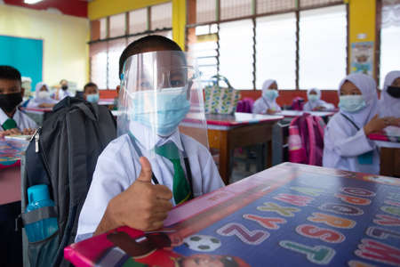Alor Setar Kedah,Malaysia-March 1,2021:The first day of the school session for preschool students in Alor Setar during the Covid-19 pandemic season is hitting the world.のeditorial素材