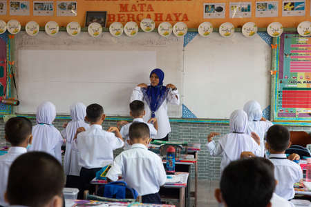 Alor Setar Kedah,Malaysia-March 1,2021:The first day of the school session for preschool students in Alor Setar during the Covid-19 pandemic season is hitting the world.のeditorial素材