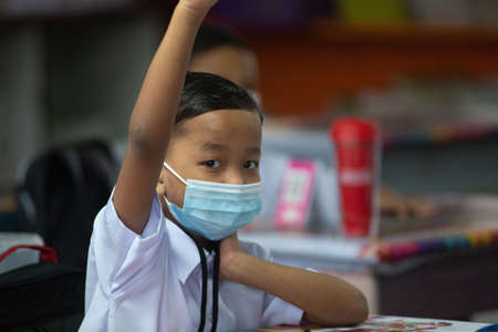 Alor Setar Kedah,Malaysia-March 1,2021:The first day of the school session for preschool students in Alor Setar during the Covid-19 pandemic season is hitting the world.のeditorial素材