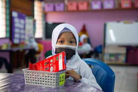 Alor Setar Kedah,Malaysia-March 1,2021:The first day of the school session for preschool students in Alor Setar during the Covid-19 pandemic season is hitting the world.のeditorial素材