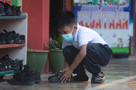 Alor Setar Kedah,Malaysia-March 1,2021:The first day of the school session for preschool students in Alor Setar during the Covid-19 pandemic season is hitting the world.のeditorial素材