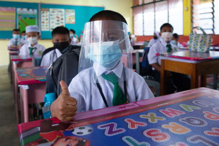 Alor Setar Kedah,Malaysia-March 1,2021:The first day of the school session for preschool students in Alor Setar during the Covid-19 pandemic season is hitting the world.のeditorial素材